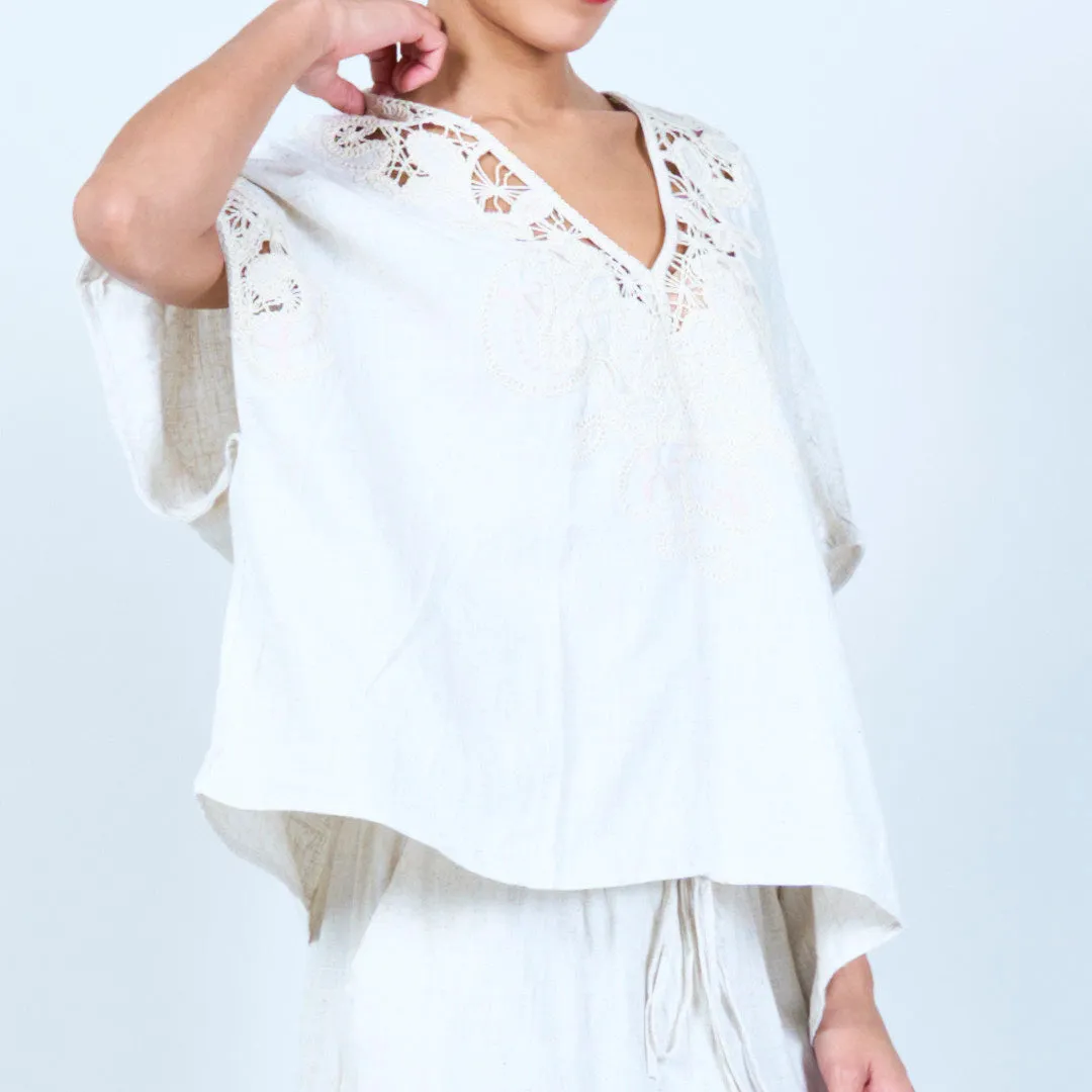 Embroidered V-neck blouse with lace details wholesale