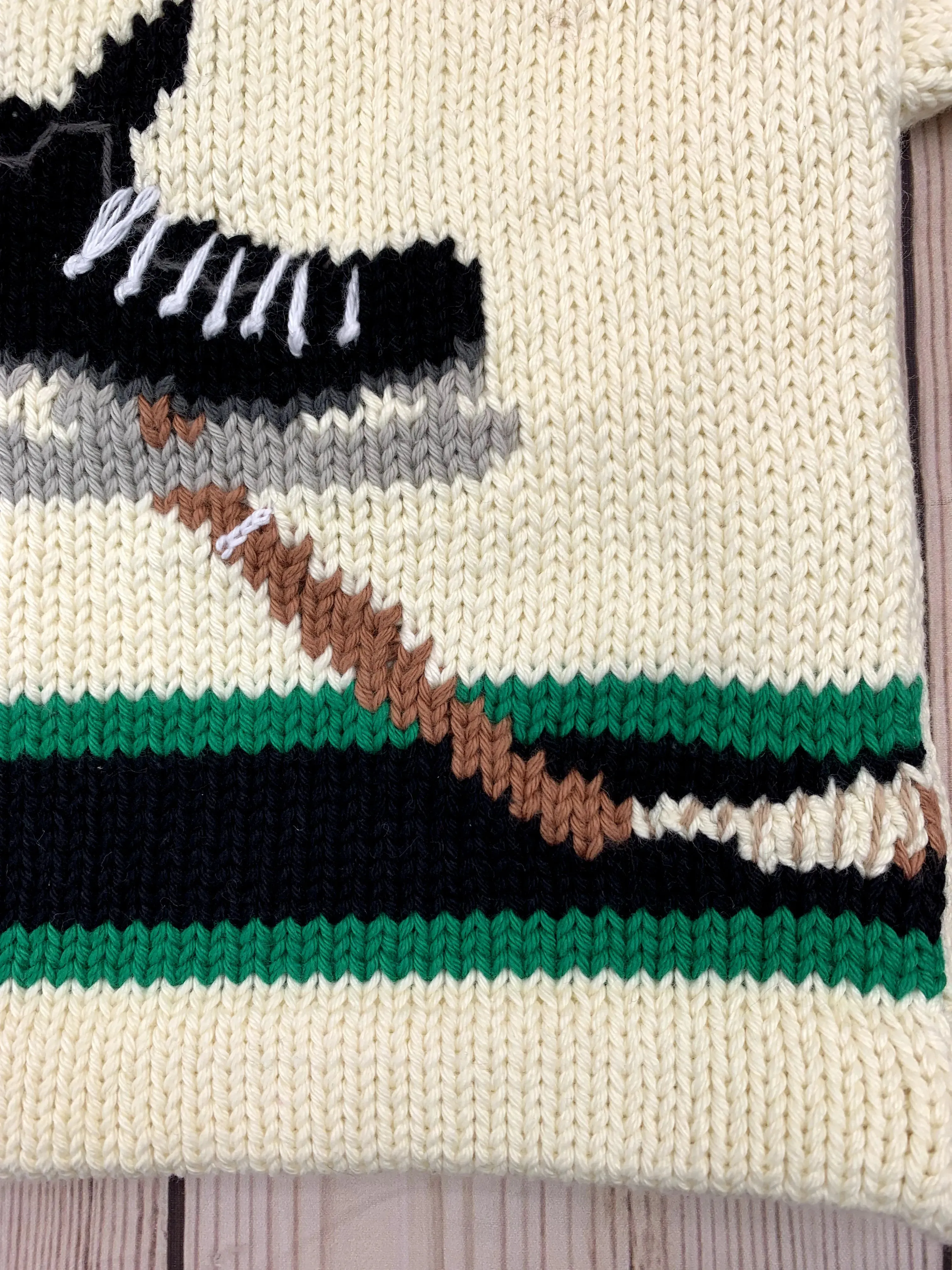 Ivory Kelly Green and Black Hockey Skate Roll Neck Sweater