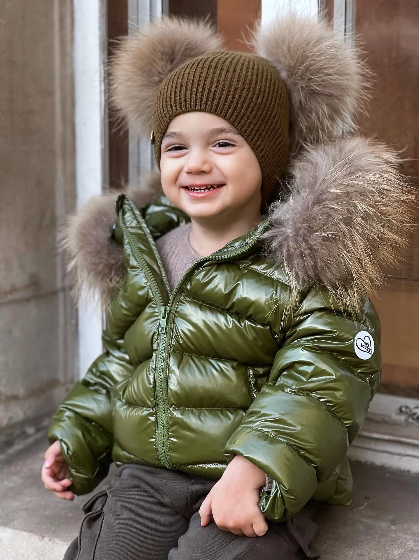 KIDS MI LOVES SIGNATURE Luxurious Racoon Fur Trim puff jacket in Khaki green colour.