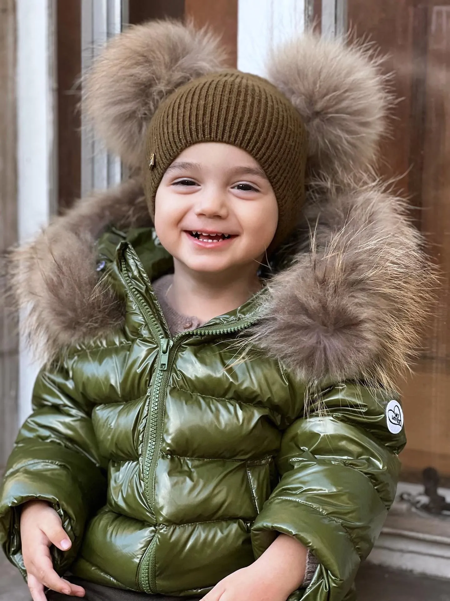 KIDS MI LOVES SIGNATURE Luxurious Racoon Fur Trim puff jacket in Khaki green colour.
