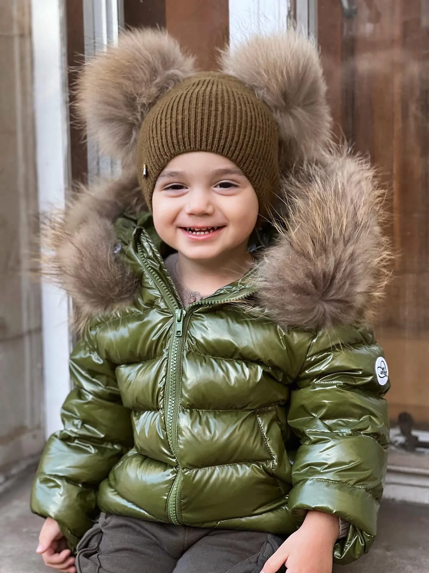 KIDS MI LOVES SIGNATURE Luxurious Racoon Fur Trim puff jacket in Khaki green colour.