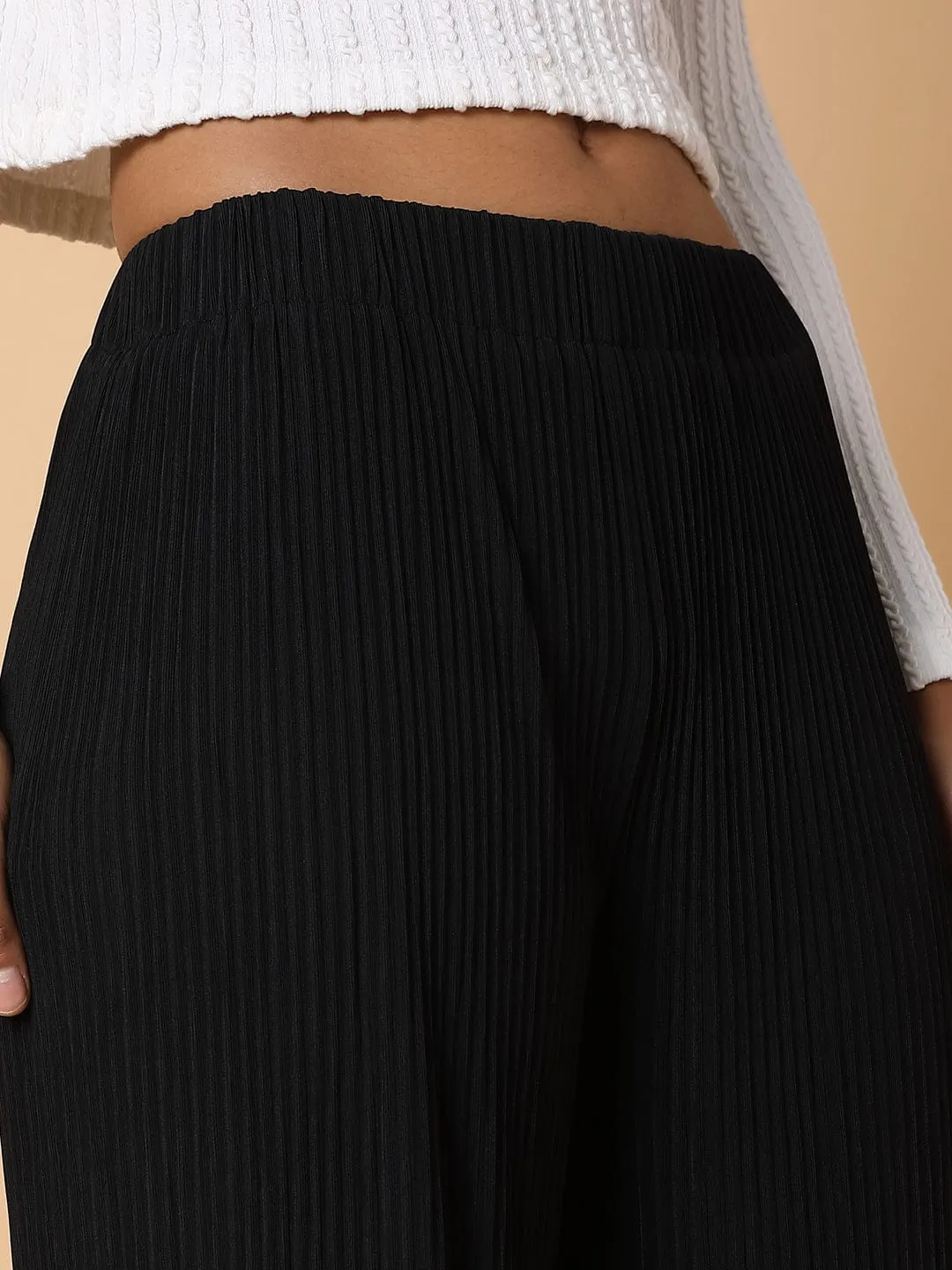 Women Black Comfort Mid-Rise Flared Trousers